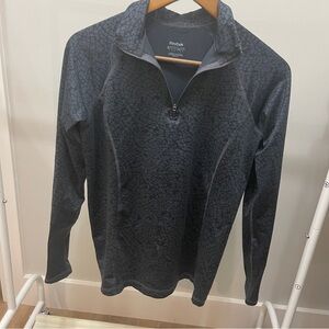 Reebok women’s Black animal print 1/4 zip pullover size L